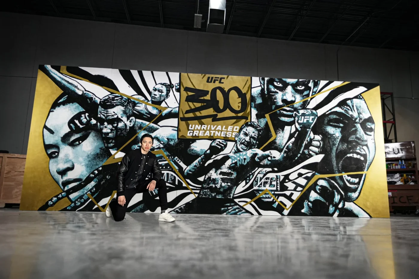 Gian Galang pictured with his wide UFC 300 mural.
