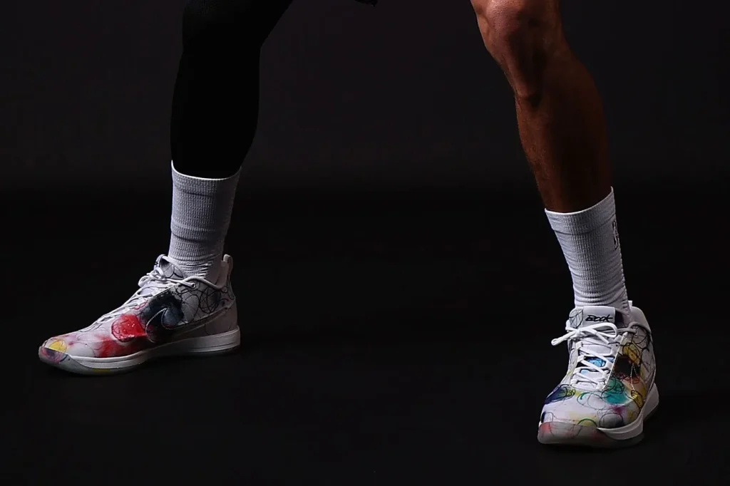 On-foot view of the multicoloured Futura Book 2 pair with white socks.