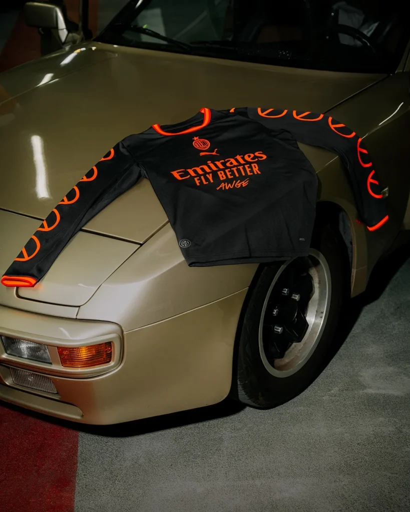 AC Milan and A$AP Rocky jersey displayed across the bonnet of a gold car