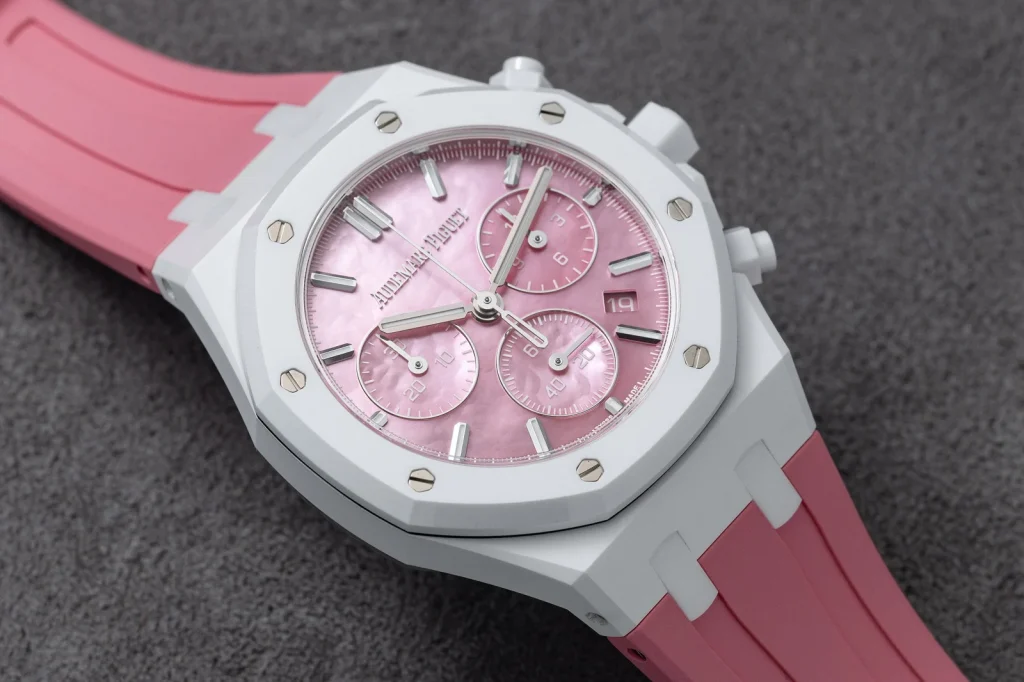 Close-up of the pink mother-of-pearl dial and white ceramic Royal Oak bezel