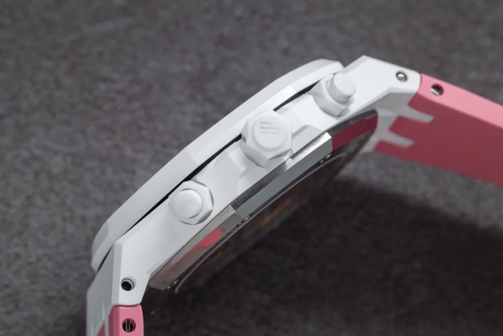 Side profile of the white ceramic Royal Oak showing the chronograph pushers and pink strap