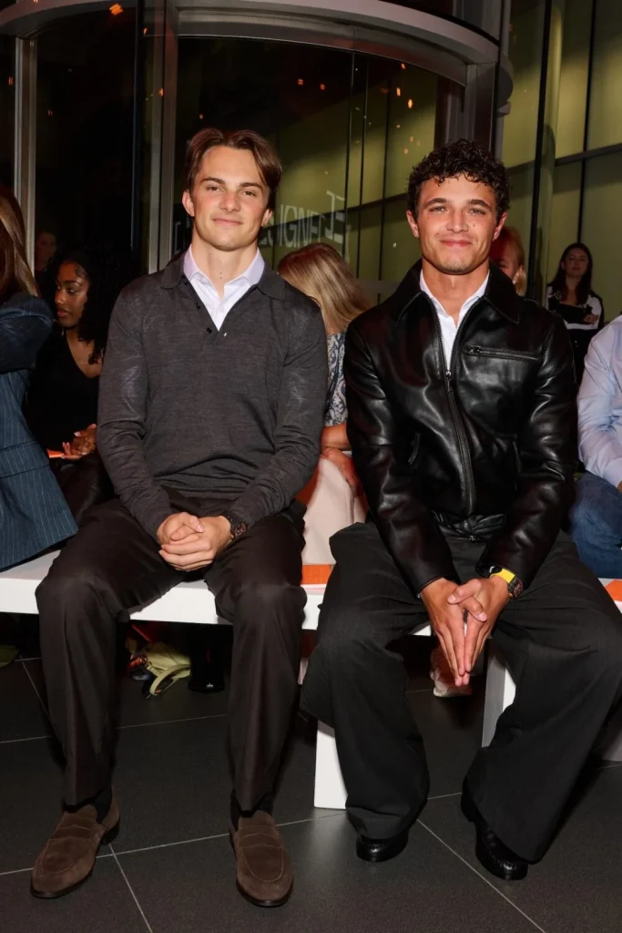 Oscar Piastri and Lando Norris seated at McLaren’s Designed to Race show