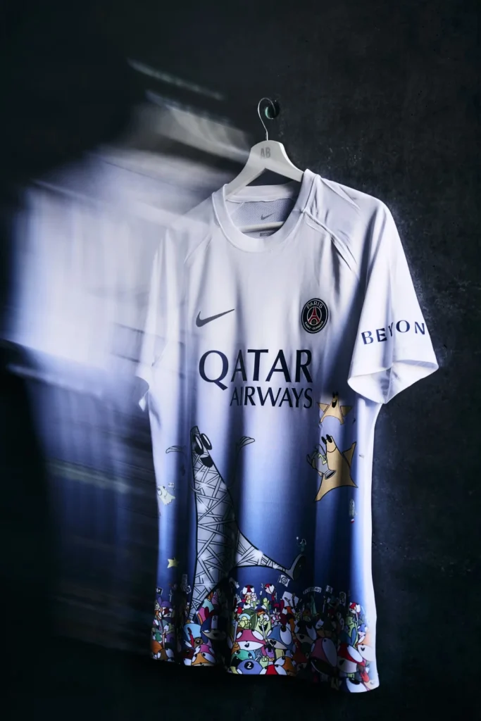Edgar Plans’s PSG Art Basel jersey on a hanger, with colourful Animal Heroes across its lower front